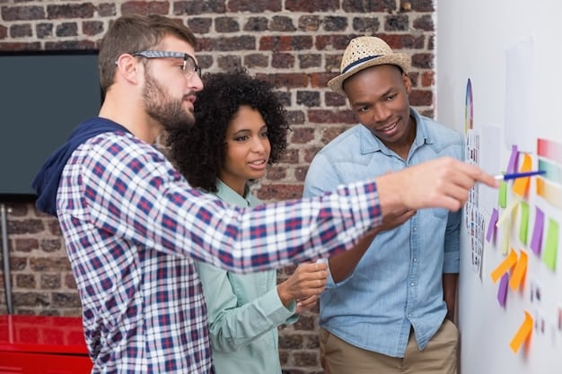 A diverse group of people brainstorming in a modern office, surrounded by whiteboards filled with ideas and technology, symbolizing innovation and collaboration.