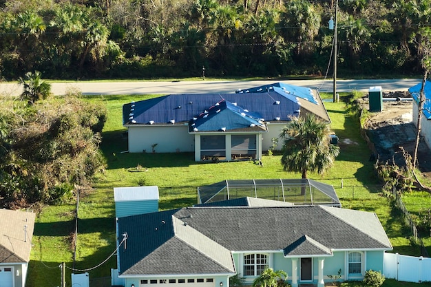 A residential neighborhood with several houses equipped with rooftop solar panels, showcasing the integration of renewable energy technology into suburban landscapes.