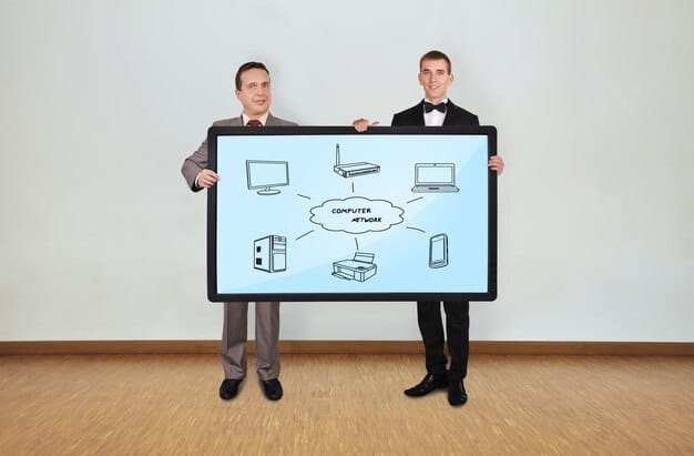 A state government official and a community leader shaking hands in front of a diagram showing broadband infrastructure plans, symbolizing collaboration on digital equity initiatives at a local level.