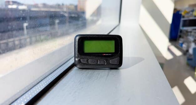 An extreme close-up of a smart water meter displaying digital readings, with a blurred background of residential pipes.