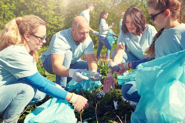 A group of community volunteers working together at a local composting facility in the US, turning organic waste into nutrient-rich soil, symbolizing community-level waste reduction efforts.