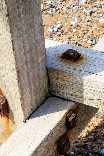 A detailed shot of sustainable timber framing being constructed for a residential home, showing the precise joinery and natural wood grain.