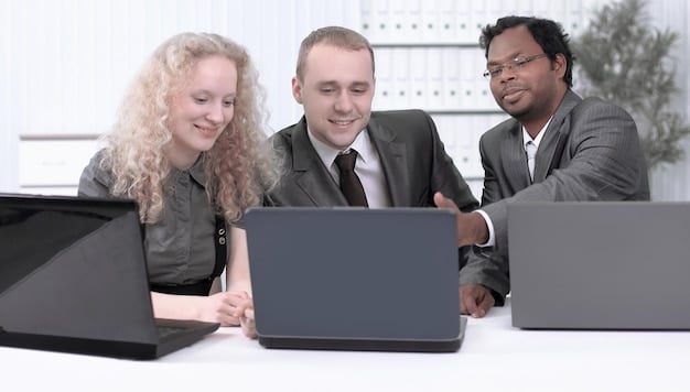 A corporate boardroom table covered with documents, laptops, and coffee cups, with diverse professionals discussing data privacy regulations on screens.