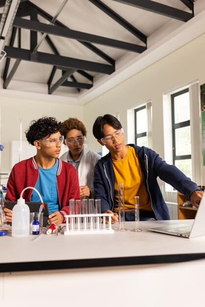 A diverse group of college students in a modern lab, working collaboratively on scientific experiments with advanced equipment, representing innovation and teamwork in STEM higher education.