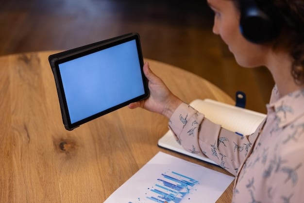 A teacher using a tablet to monitor student progress on an interactive learning dashboard, with visual data representations showing individual and class performance.