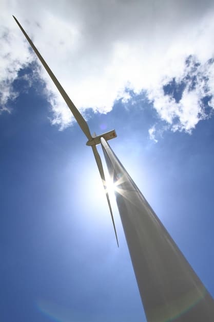 A detailed close-up of a high-efficiency solar panel reflecting the sky, with wind turbines visible in the background. The focus is on the panel's sleek design and technological sophistication, illustrating renewable energy's role in addressing climate change.