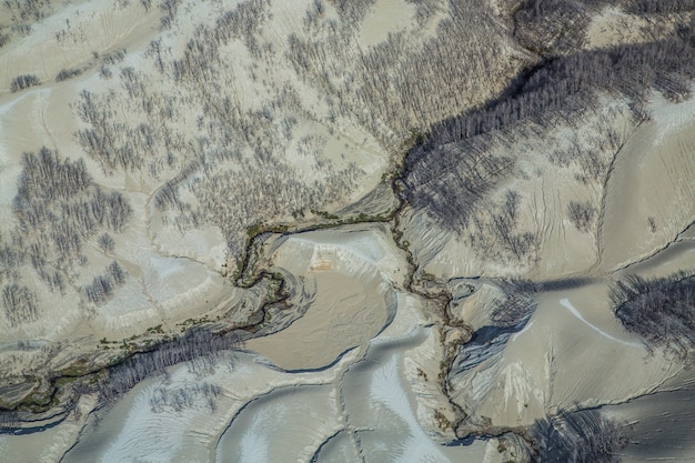 Satellite imagery showing a drastic reduction in water levels in Lake Mead over several years, highlighting receding shorelines and dry banks.