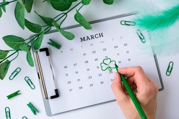 A person's hand drawing a green checkmark on a calendar with