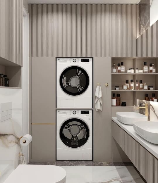 A detailed shot of an energy-efficient laundry room. A modern, front-loading washing machine and dryer are neatly installed, and a person is thoughtfully connecting a power strip to reduce phantom load, emphasizing smart energy habits.