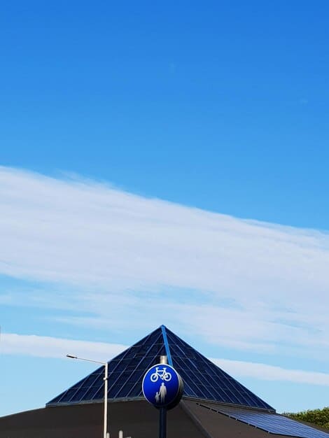 A modern solar panel installation on a rooftop with a clear blue sky in the background. The scene exemplifies renewable energy investments as a strategic opportunity amidst the US Tax Policy Update: Key Changes Affecting Investment Strategies in 2025.