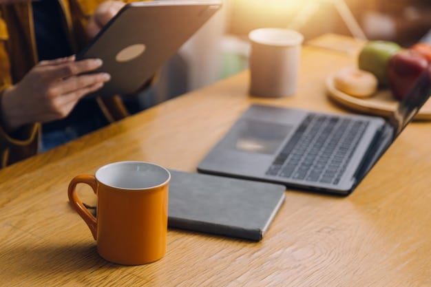 A person sitting at a desk with a laptop, intensely focused on an online learning platform, surrounded by notebooks and a cup of coffee.