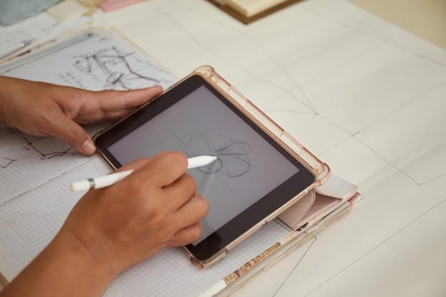 A hand sketching wireframes on a tablet, with other design tools and a focused individual in the background, illustrating the prototyping phase.