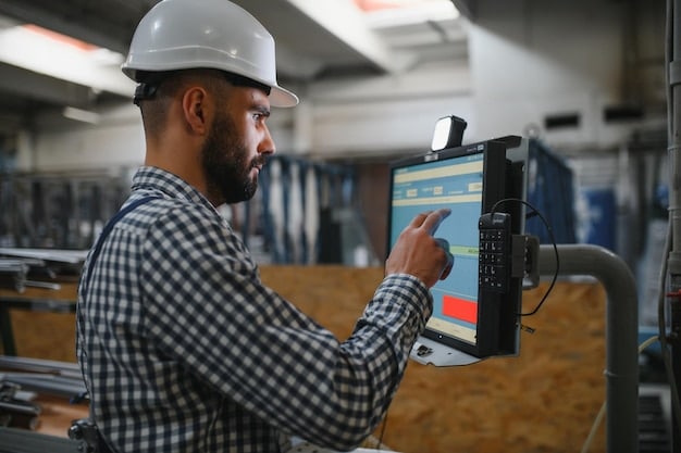 A worker using a tablet to monitor and control an automated manufacturing process. The screen displays real-time data and system controls. The background shows various automated machines working in sync. Emphasizing Robotics and Automation: Skills for the Future of Manufacturing.