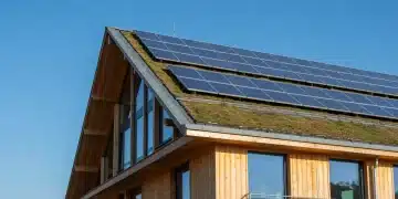 Modern green building with solar panels and green roof, symbolizing sustainable architecture.